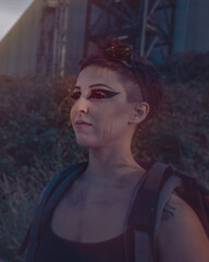 Stalker in the world of post-apocalypse. .industrial style makeup girl close-up. Woman in brutal style clothes