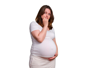 Portrait of a pregnant woman with a puzzled questioning look on a white background