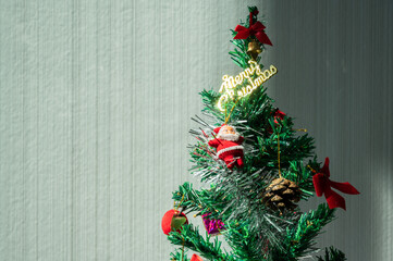 Small decorated Christmas tree during Christmas festival and New Year celebration.