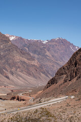 Highway over the Andes Mountains with snow-capped mountains in the background