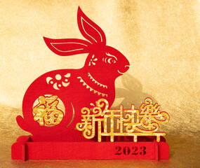 Fototapeta Chinese New Year of Rabbit mascot paper cut on gold background the Chinese words means fortune and happy Chinese New Year no logo no trademark obraz
