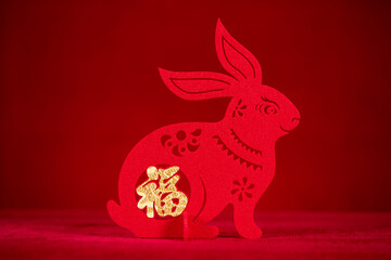 Chinese New Year of Rabbit mascot paper cut on red the Chinese means fortune no logo no trademark