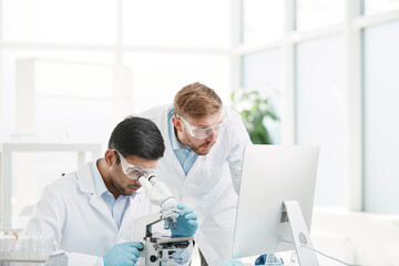 scientists are conducting research in a medical laboratory.
