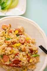 top view fried rice with crab sticks and sausages and maizes vertical composition