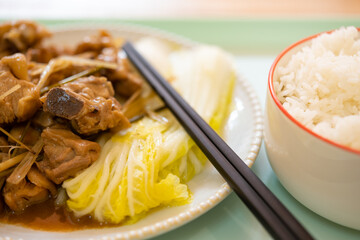angle view chicken with XiangMao or Lemongrass Herb and cabbage and bowl of rice horizontal composition