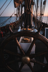 Rudder of an old sailing vessel at sunset