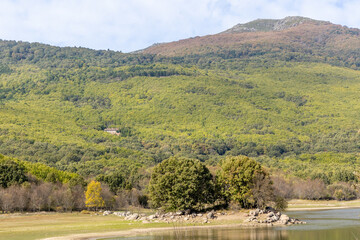 Obraz premium low water level in Morales reservoir, due to climate change, in Rozas de Puerto Real. Madrid. Spain