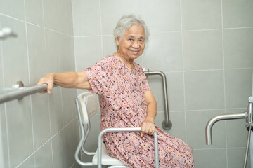 Asian senior or elderly old lady woman patient use toilet bathroom handle security in nursing...