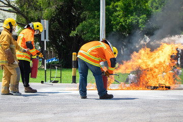 Firefighter training,Instructor training how to use a fire hose extinguisher for fighting fire