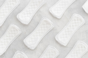 Female hygiene concept. White panty liners pattern, top view