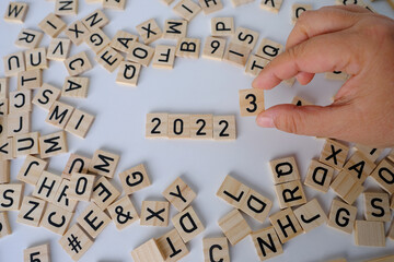 close-up of year change calendar with wood cube block tact 2023 on a light table, business concept,...