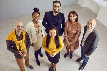 Group portrait of happy beautiful business people who work together. Team of diverse mixed race...
