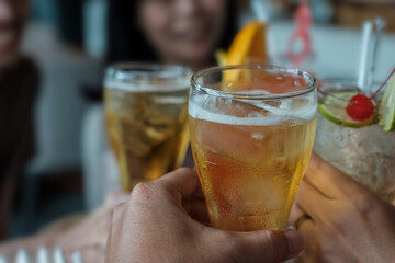 People are holding alcohol glass for drinking celebrate.