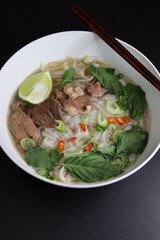 Vietnamese Instant Pho Noodle Soup with Filet and Brisket Beef, Lime, Basil, Cilantro, Green Onions, Chili