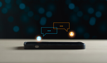 smartphone typing Live chat chatting and social network concepts, chatting conversation working at home in chat box icons pop up. Social media marketing technology concept