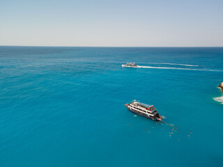 aerial view of porto katsiki beach with cruise boat people having fun