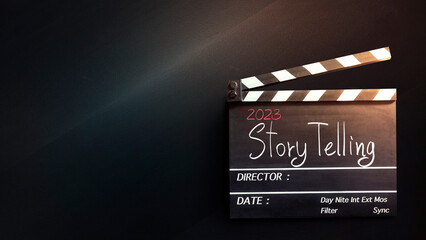 2023 story.handwriting on film slate or movie clapboard for the filmmaker.storytelling concept of...