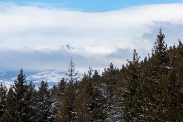 Snowy mountains and an impressive rock wall in High Tatra Mountains - the mountain range and national park in Slovakia