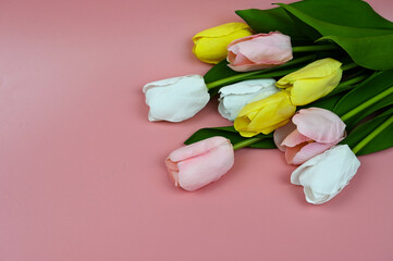 Bouquet tulips on a pink background.