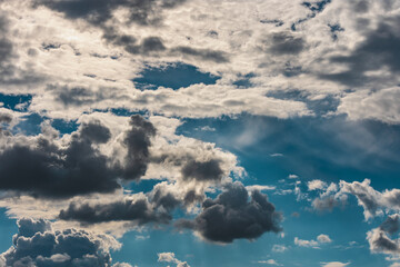 Heavy thick and thin clouds formation before the rain against blue sky