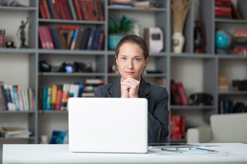 Business woman working in office. Watching webinar. Online consultant concept.