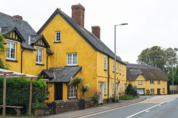 Fototapeta na wymiar Distinctively painted houses at a village crossroads in East Devon, UK