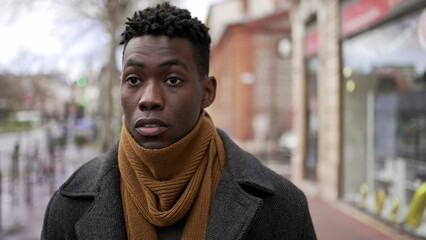 Elegant black african man walking in european downtown