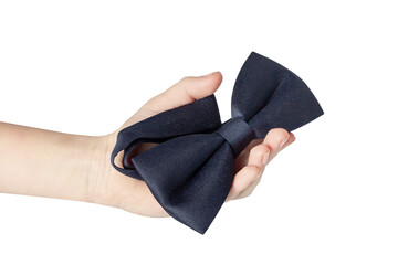 Hand holding a bow tie. Dicky bow is dark blue.