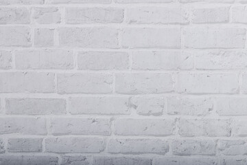White grunge brick wall texture for background. Stone tile block painted in grey light color wallpaper.