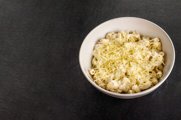 Mac and cheese. Traditional american fast food. Pasta with sauce from chedder parmesan mozarella and other cheese.