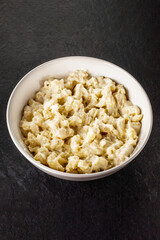 Mac and cheese. Traditional american fast food. Pasta with sauce from chedder parmesan mozarella and other cheese.