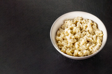 Mac and cheese. Traditional american fast food. Pasta with sauce from chedder parmesan mozarella and other cheese.