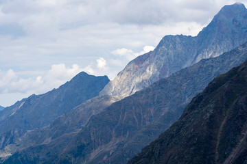 Fototapeta premium Ice and snow high in the Alps. Walking the Peiljoch (2676m) Trail. Hiking in Stubaital Valley. Photo’s of Stubaital Austria, Mieders, Neustift, Milders, Schonberg, Mutterberg, Volderau.