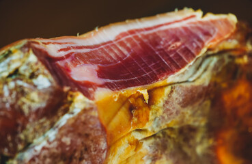 Dry-cured spanish ham Jamon. Close-up view.