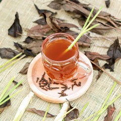 Indonesian traditional drink called lemongrass tea which is made from a mixture of pure tea and lemongrass stems brewed with a little sugar and cloves and bay leaves keeps the body warm and healthy