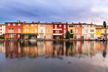 Scenic view of Port Grimaud mirror reflected to sea water against dramatic summer sky