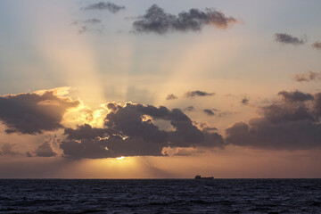 Sea sunset with sunbeams