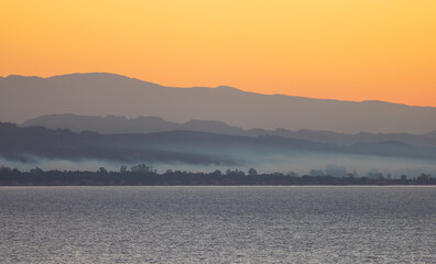 Ionian Sea with Mountain Landscape Background. Twilight Sunrise Sky. Katakolo, Greece.