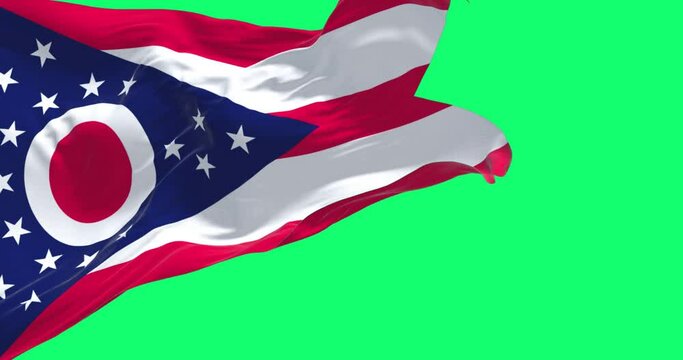 The Ohio state flag waving isolated on a green background