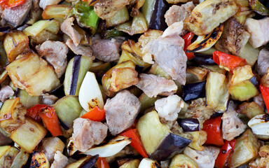 meat dish with cooked vegetables. Turkish homemade food.Eggplant kebab