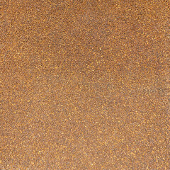 view of the surface strewn with small crystals of natural amber as a natural background