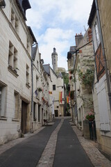 Fototapeta na wymiar narrow street in the old town of Chinon France under the stone castle