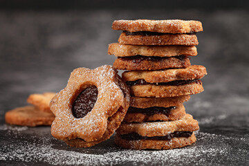 Linzer Christmas cookies. Pyramid biscuits with plum jam. Homemade pastries