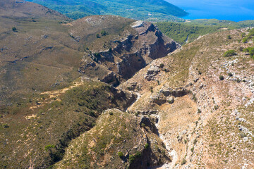 Aerial view of Jacobs Canyon. Brown massive stones and rocks in mountain canyon. Located between Siana and Embona. Rhodes, Greece.