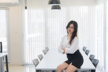 Fototapeta na wymiar Secretary beautiful girl on the desk in the office of the company.