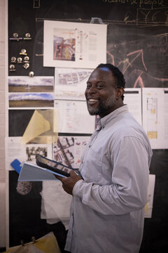 Portrait smiling male architect working in office