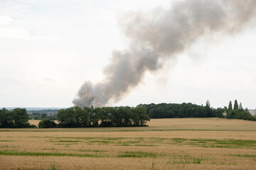 Fototapeta na wymiar black smoke rising from forest fire