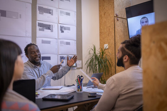 Designers talking in meeting