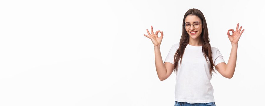 Waist-up Portrait Of Confident Sassy Young Attractive Girl In Glasses, Wink Cheeky And Smiling Reassuring All Good, No Problem, Guarantee Everything Under Control, Smile And Make Okay Signs