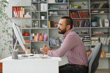 Businessman or manager working in office on computer